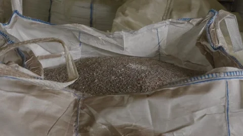 Bulk bag filled with shredded recycled plastic granules at factory Stock Footage 337580433