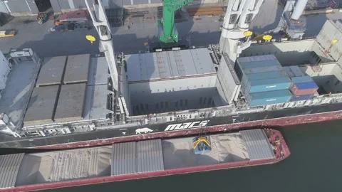 Bulk cargo from boat to ship Stock Footage 140792531