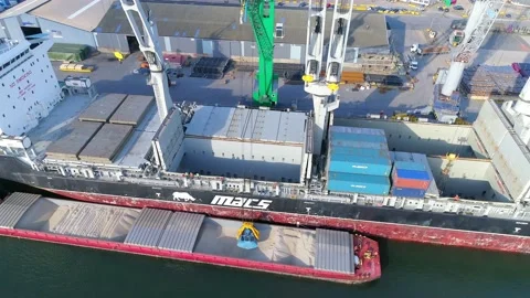 Bulk cargo from boat to ship Stock Footage 140792532