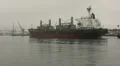 Bulk Cargo Ship In The Fog with Tugboat HD Footage