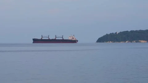 Bulk carrier cargo ship sailing on the calm sea near an Bulgaria Stock Footage 339850696