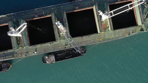 Bulk carrier is loaded by coal on anchorage. Stock Footage 120393129
