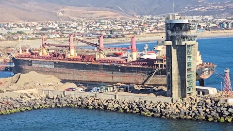 Bulk carrier loading dry cargo at Ensenada, Baja California, Mexico commercial Stock Footage 332200717