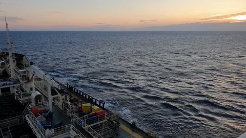 Bulk carrier with several decks sails on blue endless sea Stock Footage 113187790