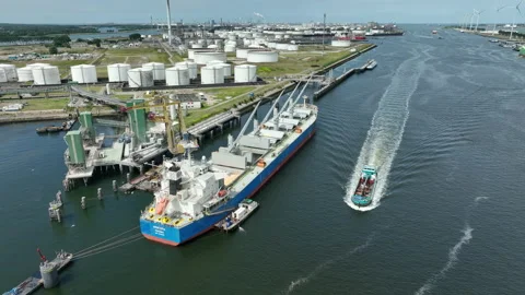 Bulk Carrier Ship at Port Offloading Cargo and Commodities Stock Footage 201396038