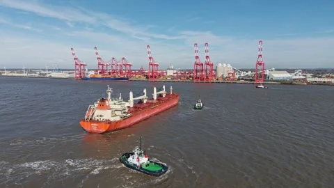 Bulk carrier ship turns in River Mersey, Liverpool, England Stock Footage 305104559