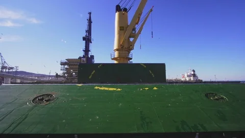 Bulk carrier unloading cargo in harbor Stock Footage 114509248