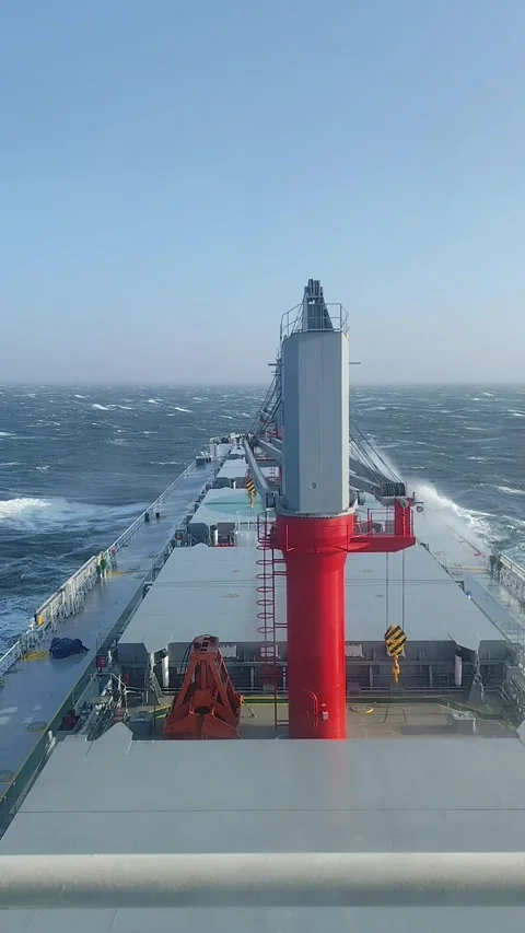 Bulk carrier vessel sails through rough ocean motion footage clip Stock Footage 344369129