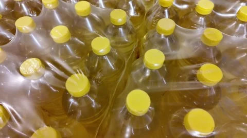 Bulk Cooking Oil Bottles Wrapped Stock Footage 284148503