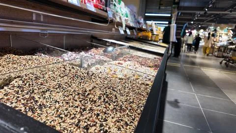 Bulk display of vegetarian ingredients including grains, nuts and seeds, Stock Photos