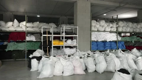 Bulk Fabric Storage in Textile Warehouse. Textile warehouse with fabric in bulk Stock Footage 272319794
