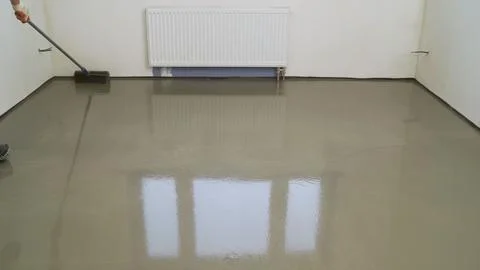 Bulk floor close-up. The process of laying a self-leveling floor. Air pumpi.. Stock Photos