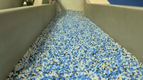 Bulk granular material mixing and sorting in industrial processing facility Video stock 342604469