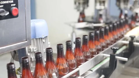 Bulk liquid bottles going for packaging chemical liquid sanitiser gel fills  Stock Footage 280335157