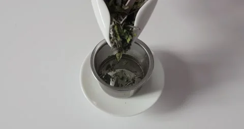 Bulk tea leaves on a white background Stock Footage 153106338