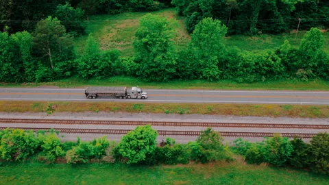 Bulk Trailer on Highway Aerial - Open-Top Commodity Hauler with Rolling Tarp Stock Footage 340184771