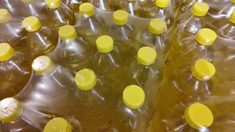 Bulk Yellow Capped Plastic Bottles Stock Footage 284148543