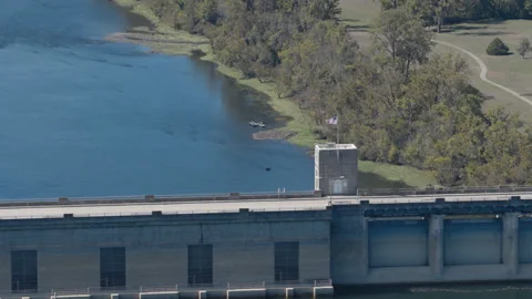 Bull Shoals Dam Control Tower Above Blue Water with American Flag Stock Footage 344217136
