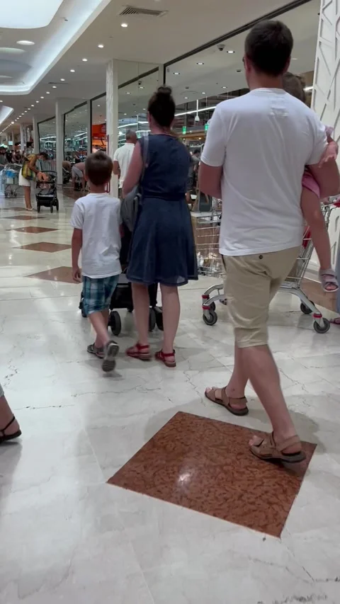 Bull Terrier Gets Pulled Along During Shopping Trip, San Mauro, Pascoli, Italy - Stock Footage 205430691