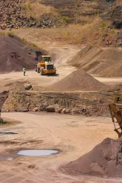 Bulldozer in action in the quarry Stock Photos