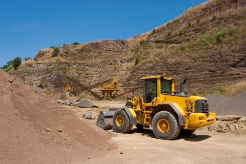 Bulldozer in action in the quarry Stock Photos