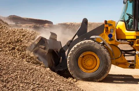 Bulldozer in action in the quarry Stock Photos