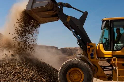 Bulldozer in action in the quarry Foto stock