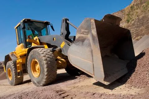 Bulldozer in action in the quarry Stock Photos