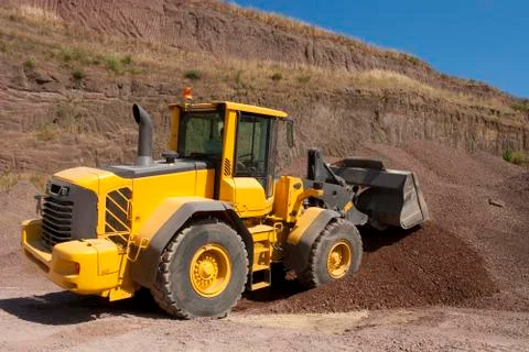 Bulldozer in action in the quarry Stock Photos