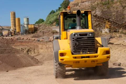 Bulldozer in action in the quarry Stock Photos