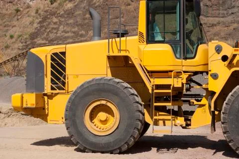 Bulldozer in action in the quarry Stock Photos