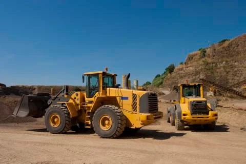 Bulldozer in action in the quarry Stock Photos