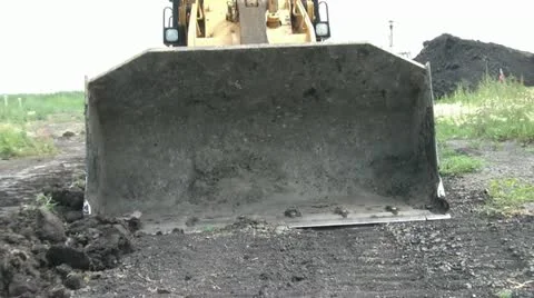Bulldozer Approaches Camera With Dirt 스톡 동영상 12572192