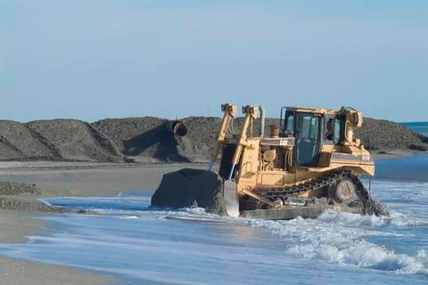 Bulldozer on beach Stock Photos