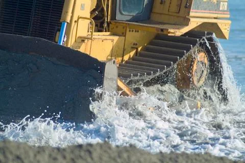 Bulldozer on beach Stock Photos