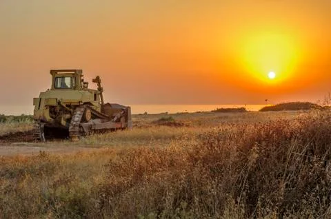 Bulldozer on the beach Stock Photos