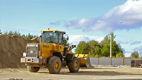 Bulldozer with bucket construction high-speed road Stock Footage 88424945