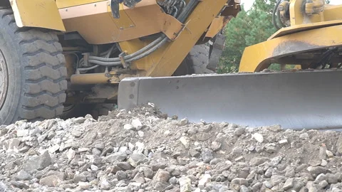 A bulldozer clears the area for road construction. Stock Footage 288226614