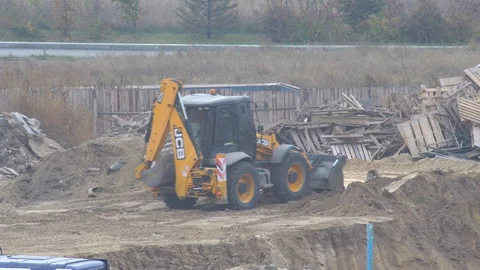 Bulldozer digging ground at a construction site. bucket is gaining ground Stock-Footage 120673870