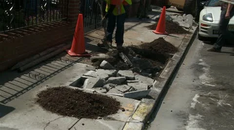Bulldozer Digging up sidewalk for tree planting Stock Footage 11024362