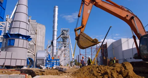 Bulldozer does earthworks and the foreman and workers control it Stock Footage 161990760