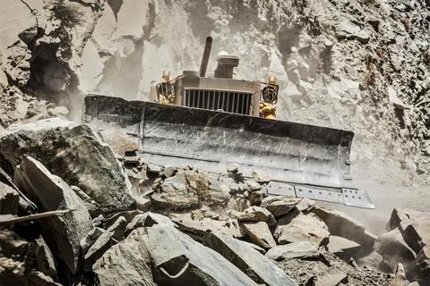 Bulldozer doing mountain road construction in Himalayas Himachal Pradesh India Stock Photos