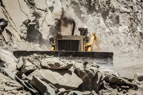 Bulldozer doing mountain road construction in Himalayas Himachal Pradesh India Stock Photos
