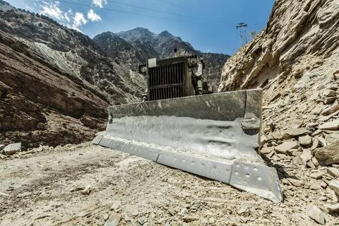 Bulldozer doing mountain road construction in Himalayas Himachal Pradesh India Stock Photos