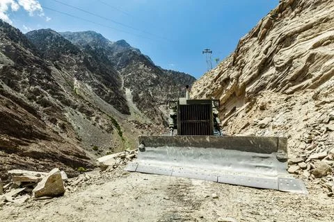 Bulldozer doing mountain road construction in Himalayas Himachal Pradesh India Stock Photos