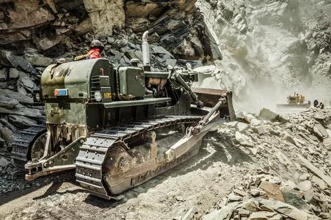 Bulldozer doing mountain road construction in Himalayas Himachal Pradesh India Stock Photos