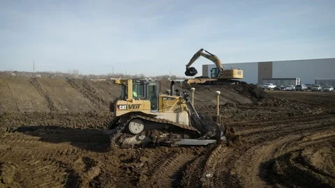 Bulldozer Driving Through Active Construction Site Stock Footage 145377950