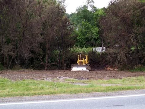 Bulldozer on empty lot Stock Photos