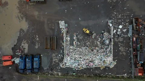 Bulldozer leveling garbage in landfill Stock Footage 123643931