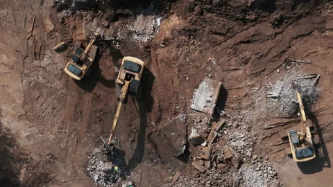 A bulldozer levels a plot of land for construction development. Top down shot Stock Footage 256325127